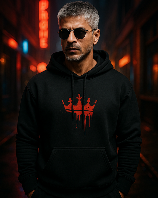 Shah Rukh Khan wearing a black hoodie with a red bloody crown logo inspired from the movie King in a dark, neon-lit alleyway.