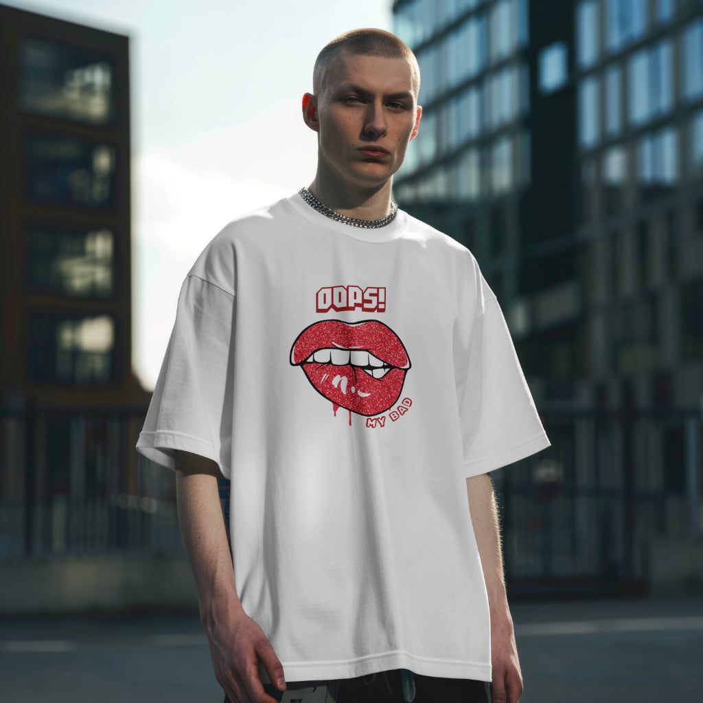 A male model standing straight wearing 'Oops My Bad' graphic oversized tshirt in white