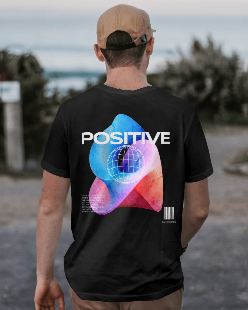 back view of a male model with a cap wearing Cosmic Positive black tshirt