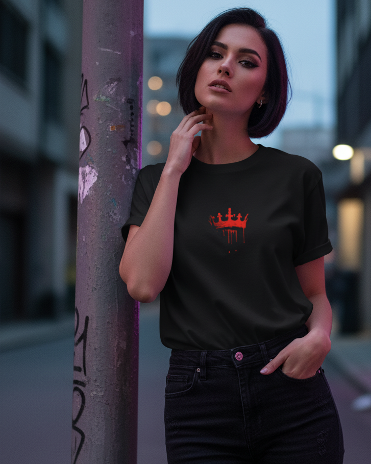Woman wearing a black t-shirt with a red King movie logo in an urban setting
