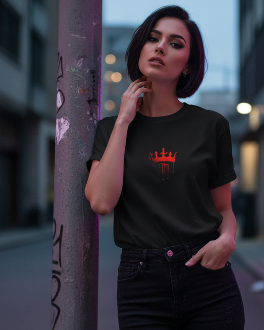 Woman wearing a black t-shirt with a red King movie logo in an urban setting