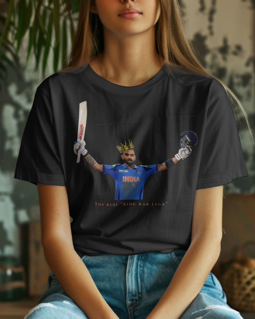 a female model sitting wearing a black color Virat Kohli tshirt