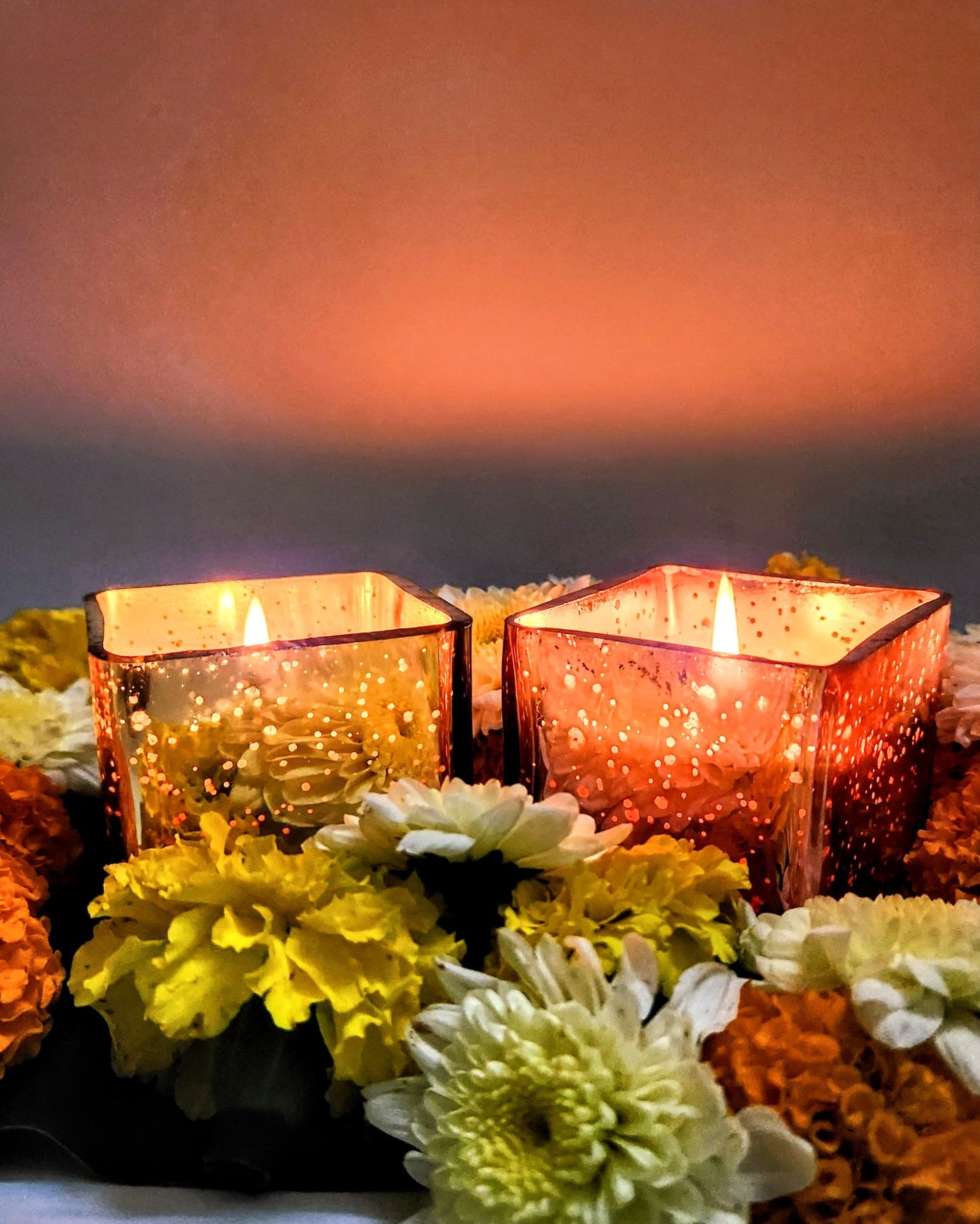 illuminated rose gold and gold glass jar candle