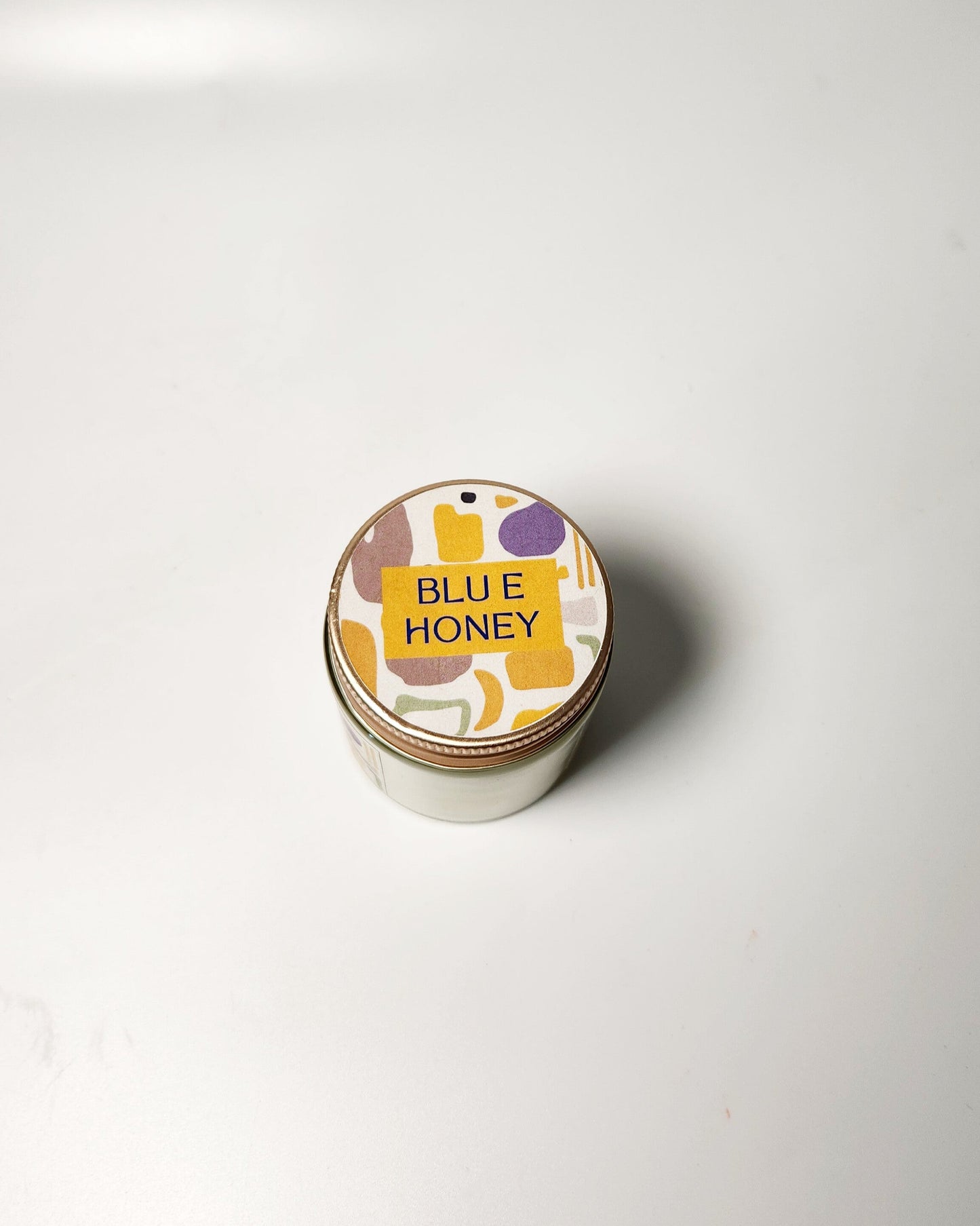 Jar of soy wax candle on a white background