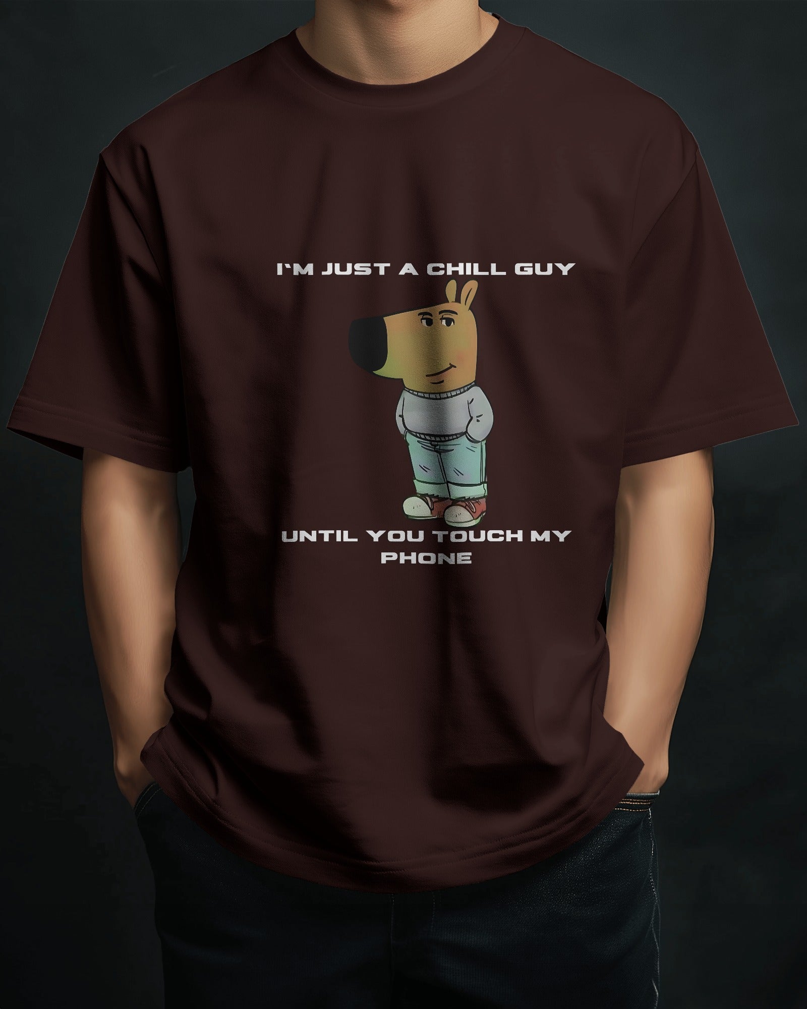 a male model standing with his hands in his pockets wearing a coffee brown "I’m Just a Chill Guy… Until You Touch My Phone" tshirt