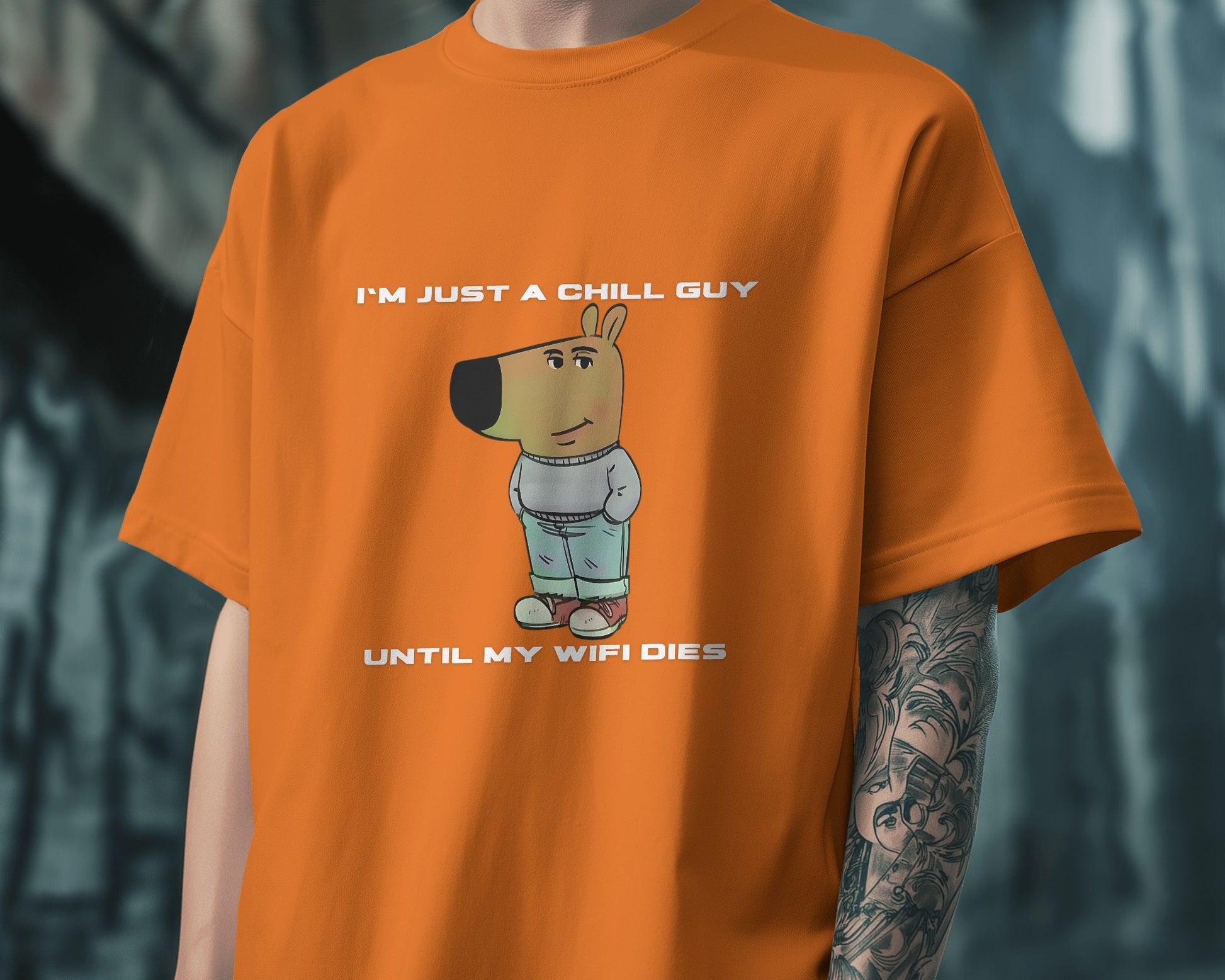 a model wearing I'm just a chill guy until my WIFI dies orange t-shirt.