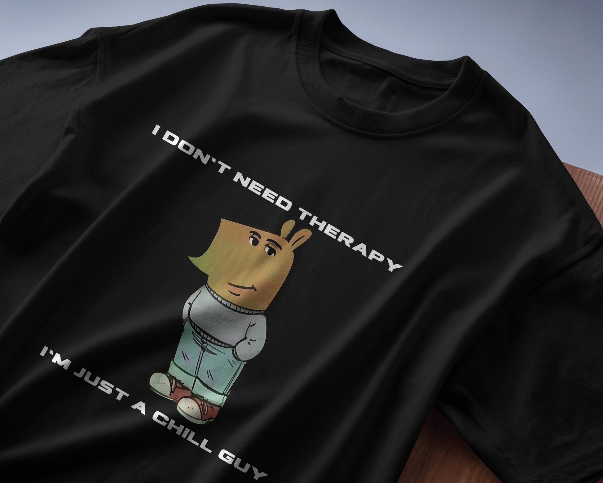 folded I'm just a chill guy, I don't need therapy black t-shirt.