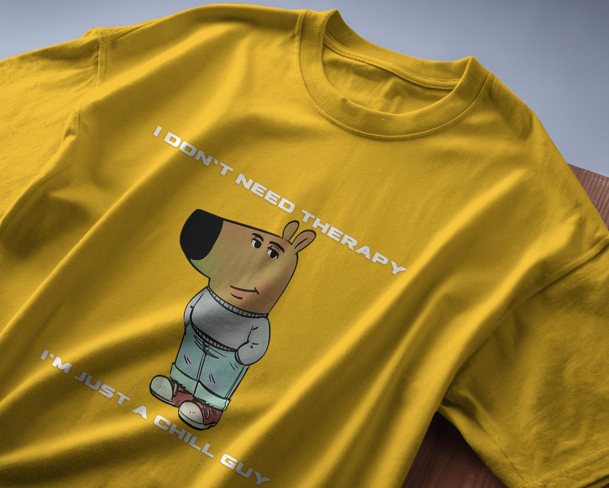 folded I'm just a chill guy, I don't need therapy yellow t-shirt.
