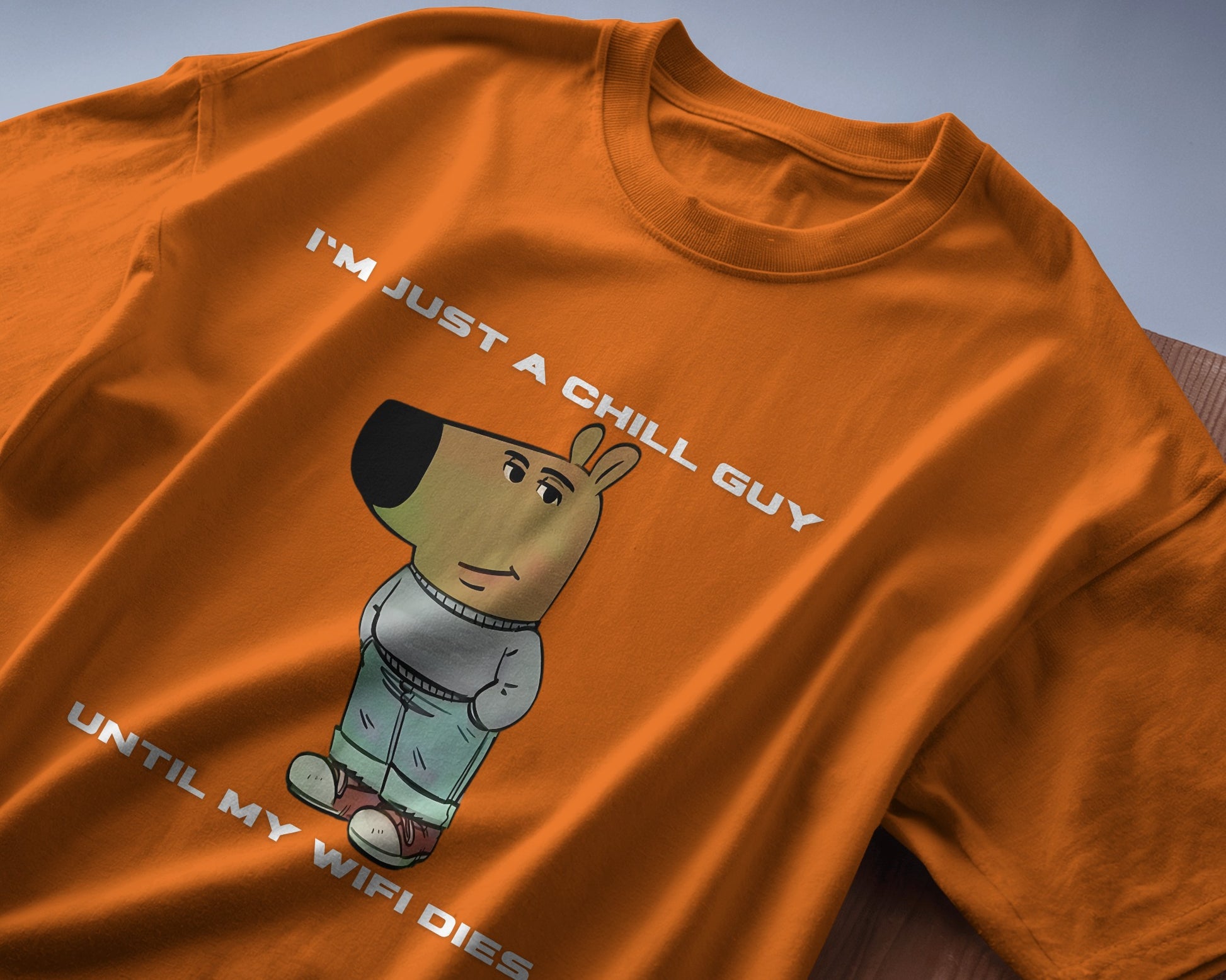 folded orange I'm just a chill guy until my WIFI dies t-shirt.