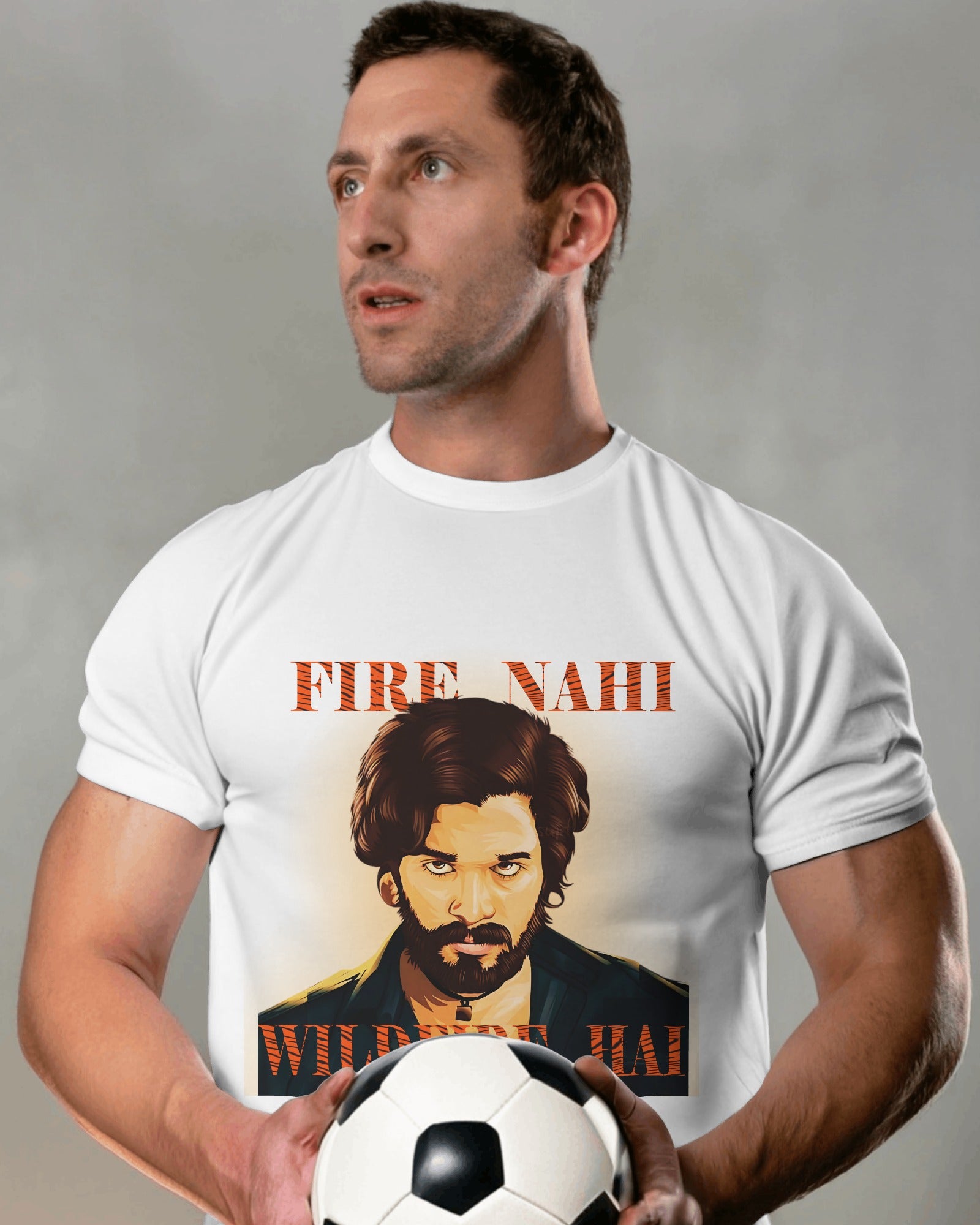 an american model holding a football in hand wearing Fire Nahi Wildfire Hai 'Pushpa 2' T-shirt white