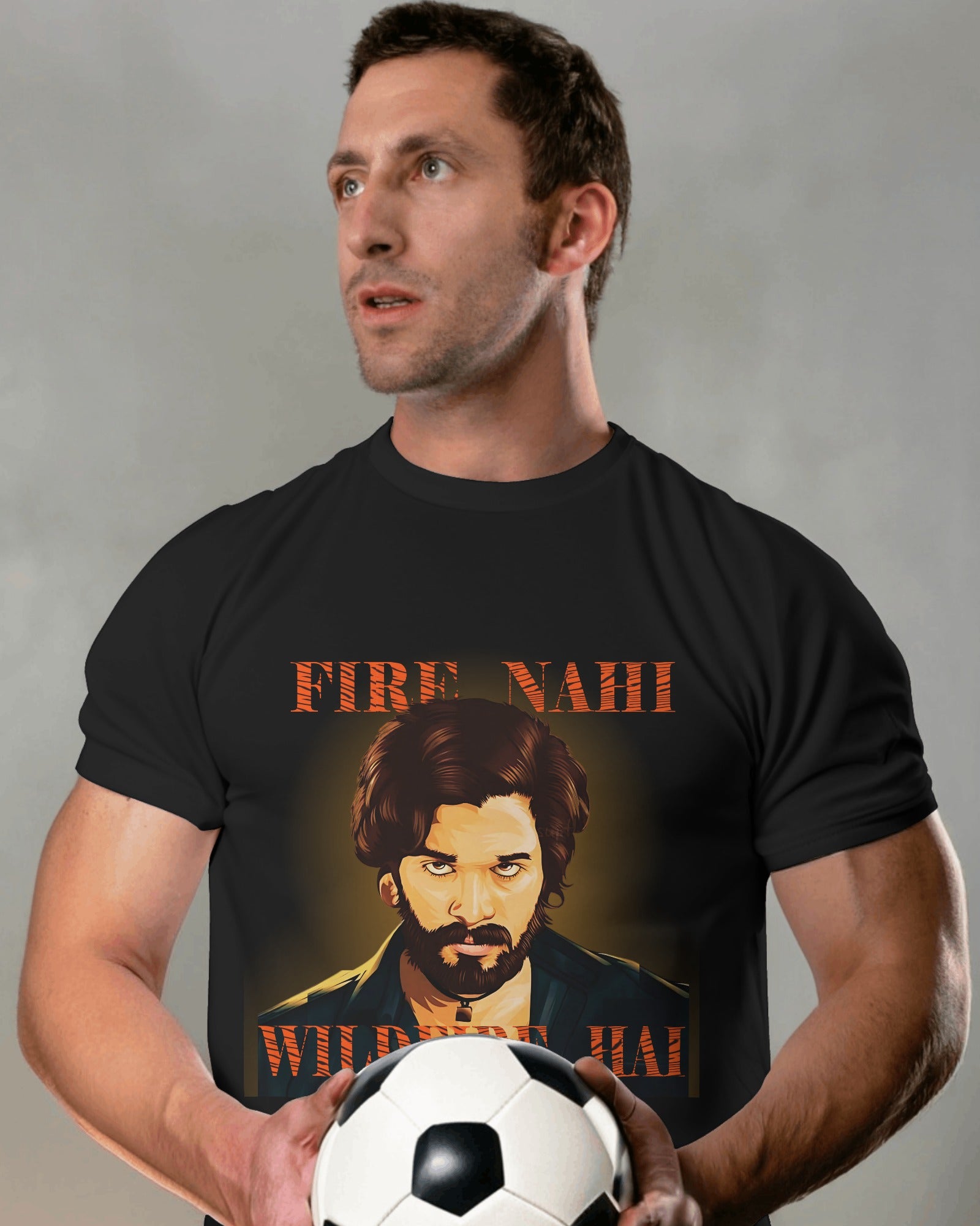 an american model holding a football in hand wearing Fire Nahi Wildfire Hai 'Pushpa 2' T-shirt black