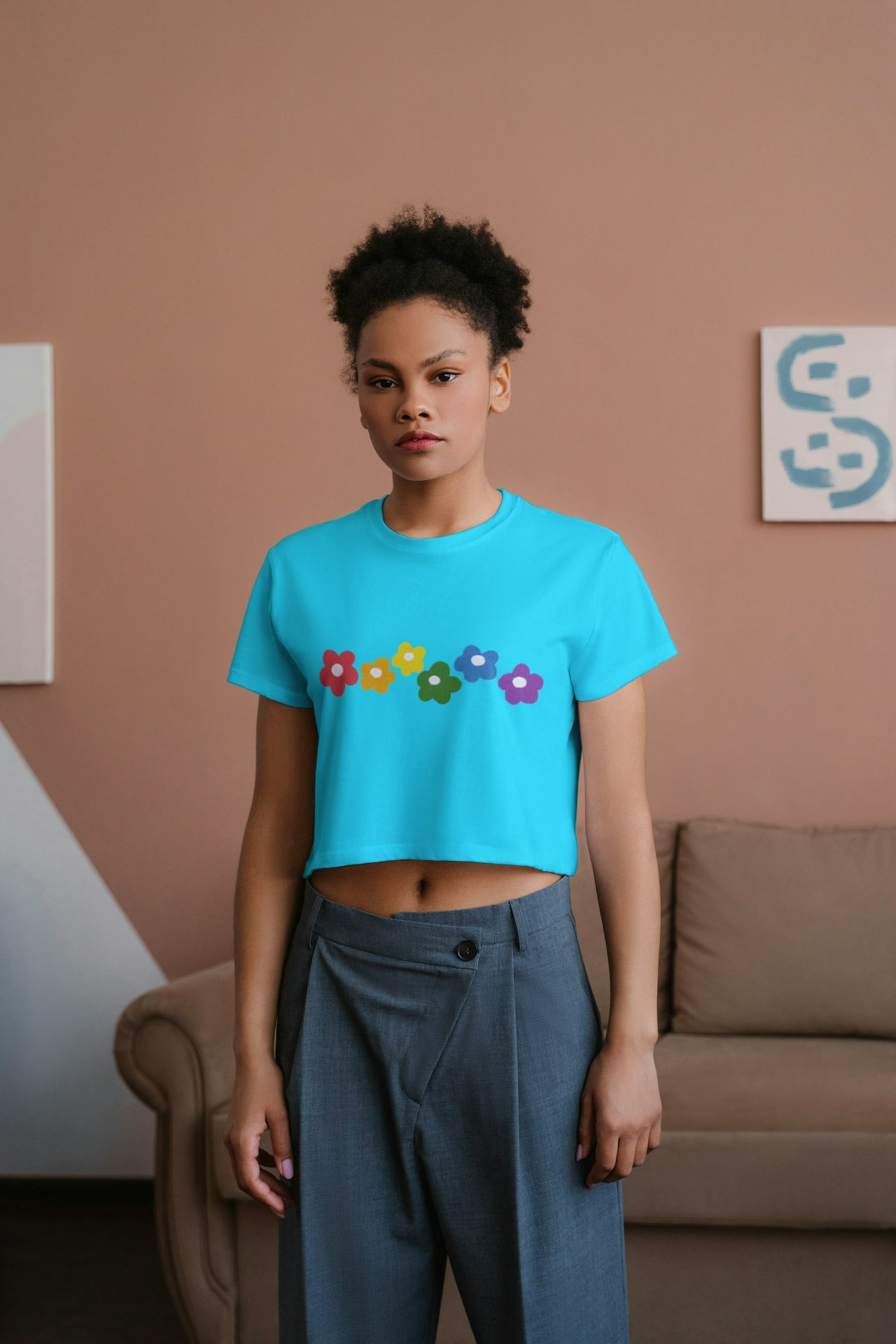 an African model female wearing Rainbow Bloom Crop Top sky blue
