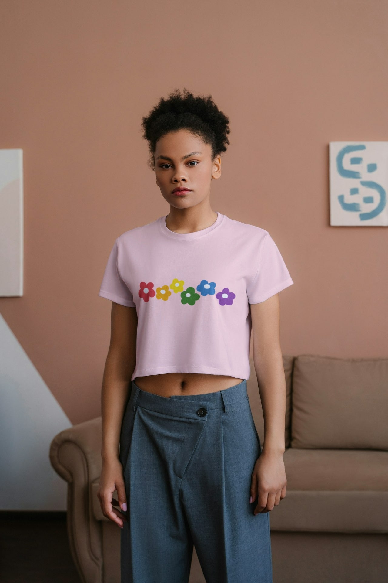 an African model female wearing Rainbow Bloom Crop Top pink