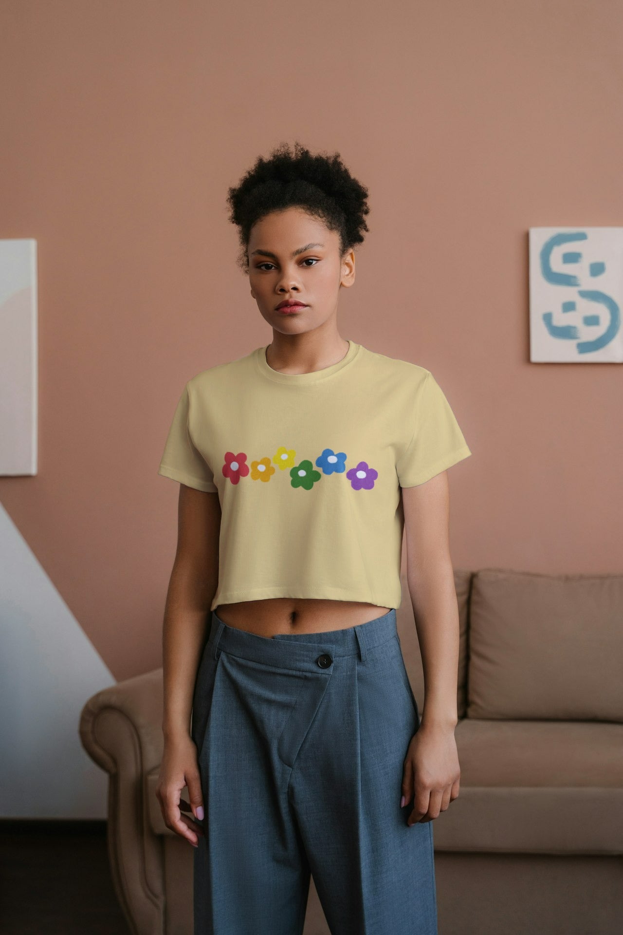 an African model female wearing Rainbow Bloom Crop Top yellow