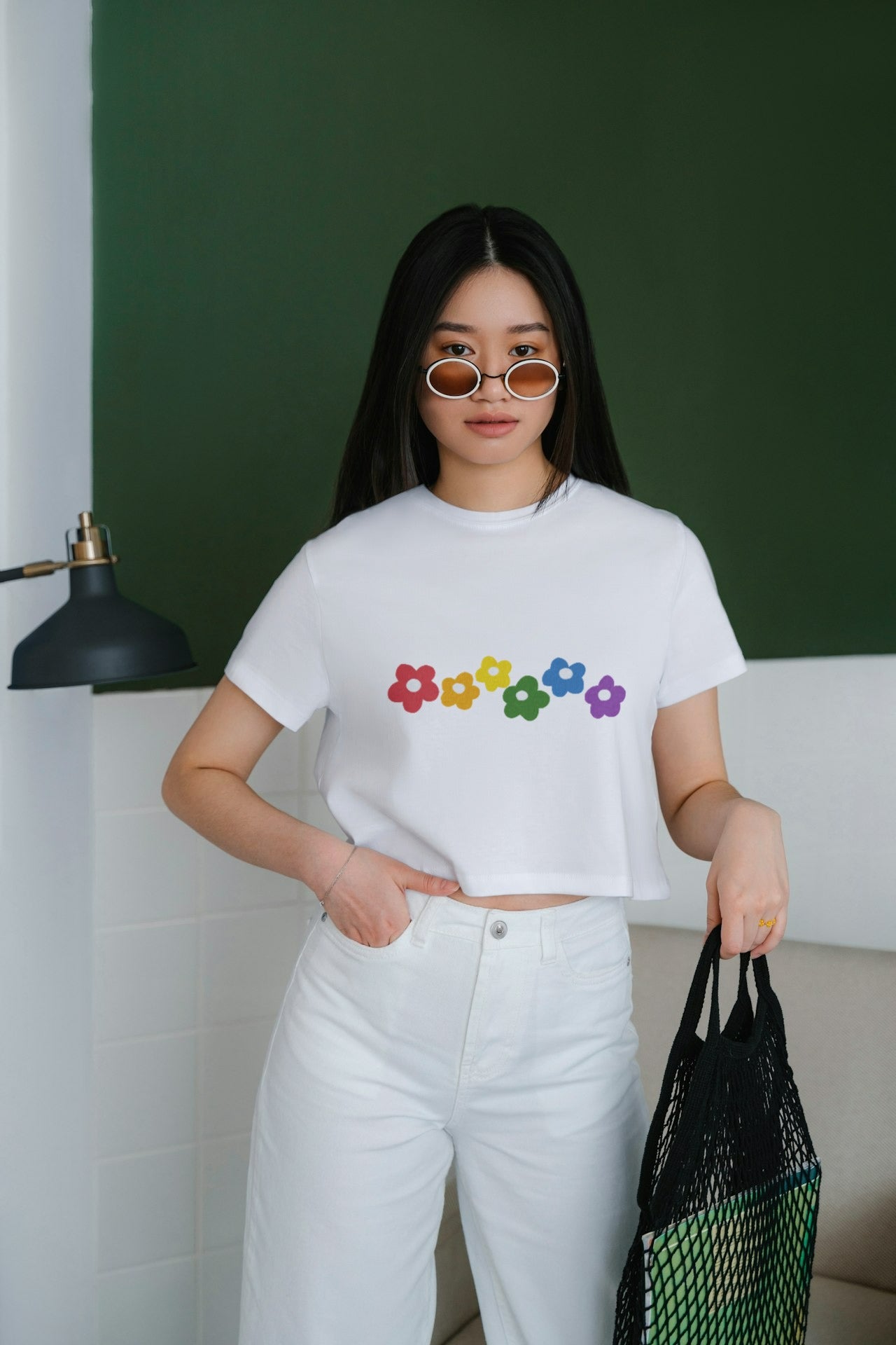 an Asian model female wearing Rainbow Bloom Crop Top white