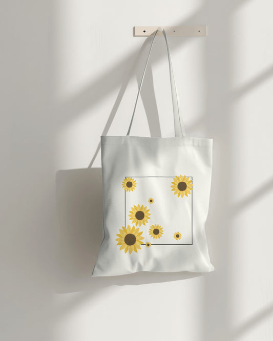 a white sunflower tote bag with zipper on a hanger