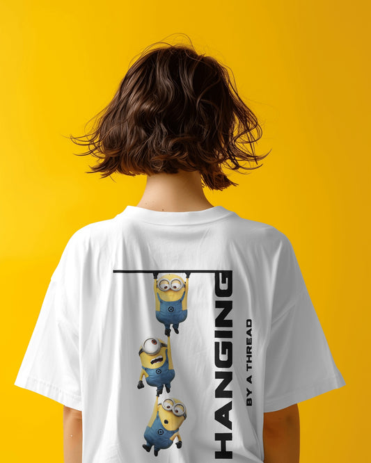 back view of an Asian female model wearing an oversized white Minions tshirt