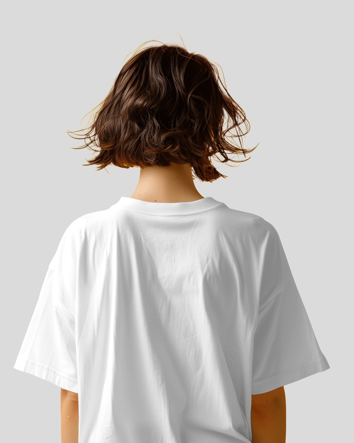 back view of an Asian model wearing an Oversized Diljit Dosanjh "Diluminati" T-Shirt white