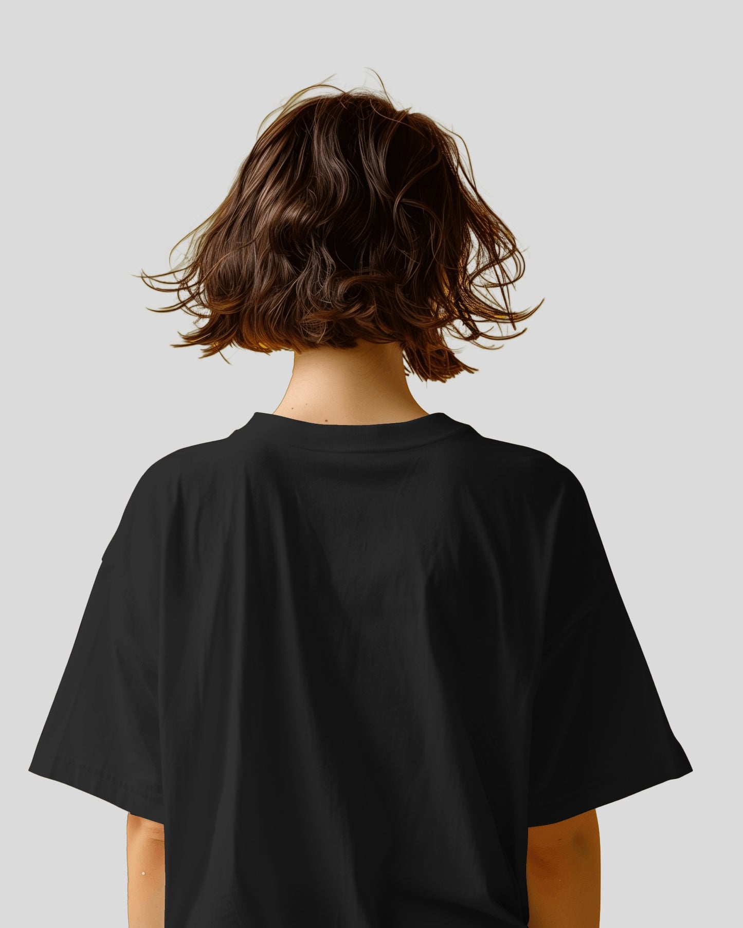 back view of an Asian model wearing an Oversized Diljit Dosanjh "Diluminati" T-Shirt black
