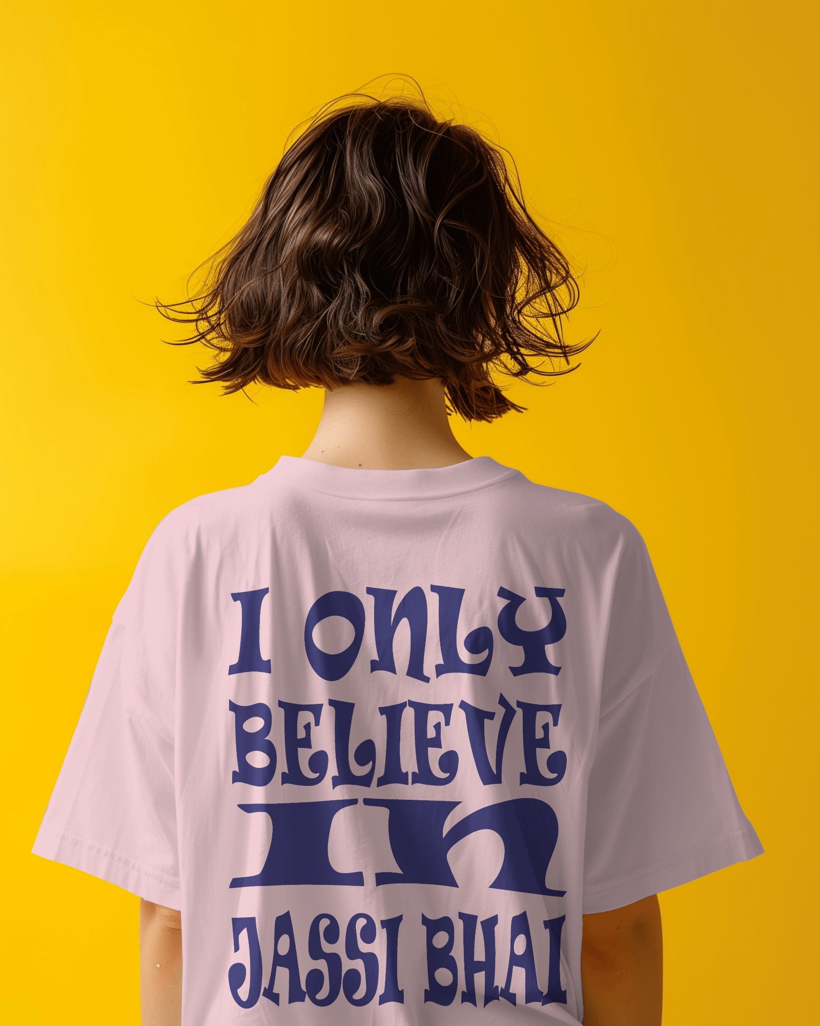 Back view of a female model wearing I only Believe in Jassi Bhai Oversized Tshirt pink