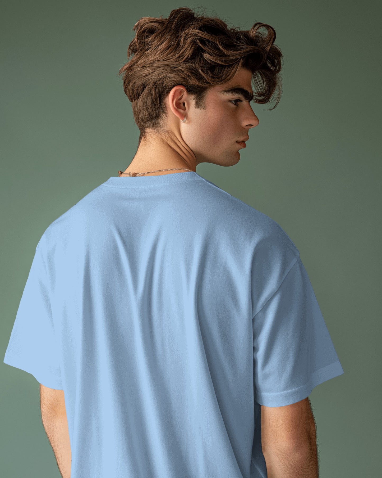 a white male model showing the plain back of the Selenophile baby blue oversized tshirt