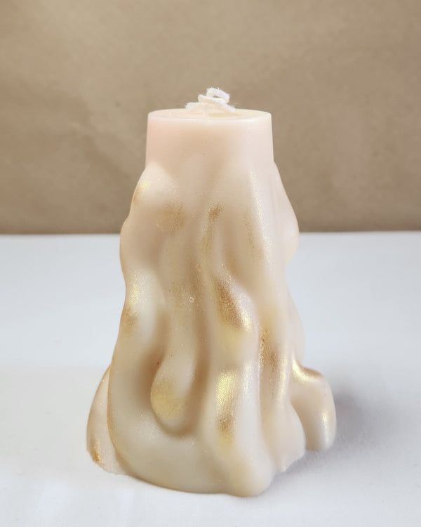 A 4" x 9.5" white 3D wave soy wax pillar candle with gold shimmer, front view.