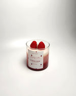 Eternal Rose scented soy wax candle with strawberry and rose fragrance, featuring two real strawberries on top.