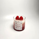 Eternal Rose scented soy wax candle with strawberry and rose fragrance, featuring two real strawberries on top.