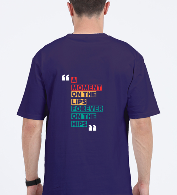 Back view of a unisex oversized navy blue t-shirt with colorful typography reading 'A Moment on the Lips, Forever on the Hips'.