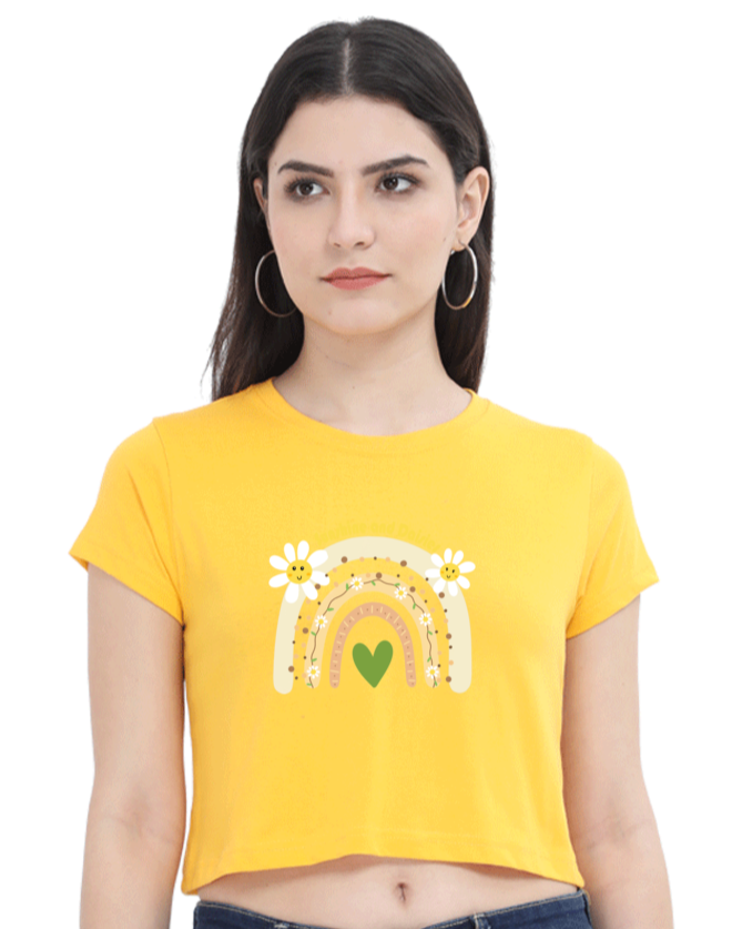 Yellow Sunshine and Daisies crop tee with a rainbow and heart graphic, front view.