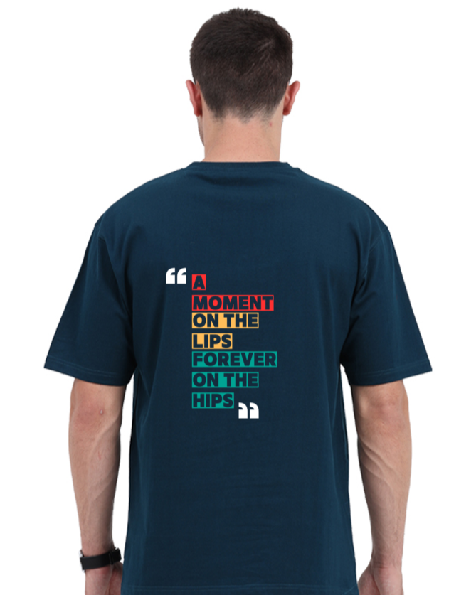 Back view of a unisex oversized navy blue t-shirt with colorful 'A Moment on the Lips, Forever on the Hips' typography.