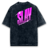 Back view of a unisex, oversized, acid-washed black t-shirt with a vibrant pink 'SLAY' graphic.