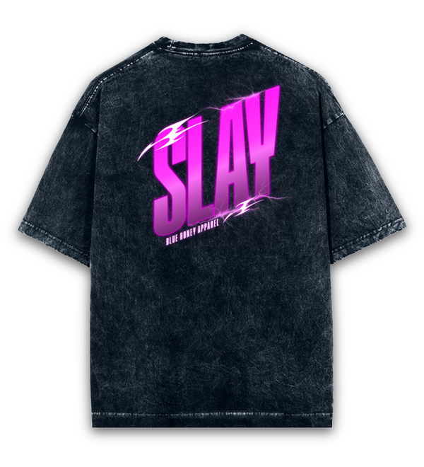 Back view of a unisex, oversized, acid-washed black t-shirt with a vibrant pink 'SLAY' graphic.