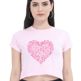 Front view of a pink crop top with a heart made of 'XOXO' symbols, perfect for a casual and trendy look.