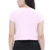 Back view of a pink Heart XOXO crop top worn by a woman with black jeans.