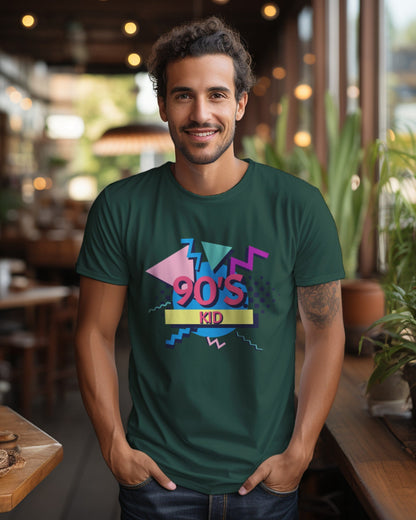 A male model with his hands in his pocket wearing aa '90s Kid' bottle green T-shirt