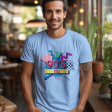 Front view of a light blue t-shirt with a '90s Kid' graphic, worn by a smiling man.