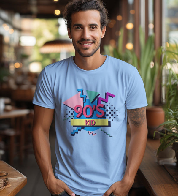 Front view of a light blue t-shirt with a '90s Kid' graphic, worn by a smiling man.