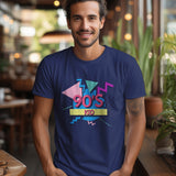 A man smiles wearing a navy blue '90s Kid' graphic t-shirt with a retro design.