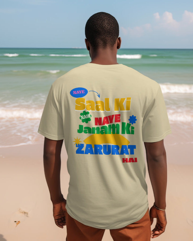 back view of a black male wearing 'Naye Saal Ki Nahi Naye Janam Ki Zarurat Hai' Beige Tshirt