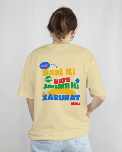 back view of a female wearing 'Naye Saal Ki Nahi Naye Janam Ki Zarurat Hai' Beige Tshirt