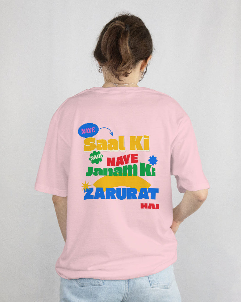 back view of a female wearing 'Naye Saal Ki Nahi Naye Janam Ki Zarurat Hai' Pink Tshirt