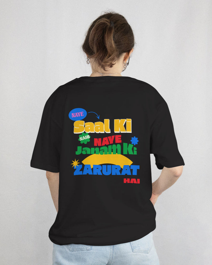 back view of a female wearing 'Naye Saal Ki Nahi Naye Janam Ki Zarurat Hai' Black Tshirt