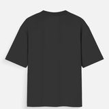 Back view of a black unisex oversized standard t-shirt with a crew neck and short sleeves.