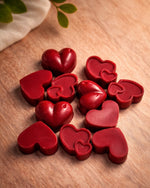 Bulgarian Rose Heart Diffuser Gift Set featuring red heart-shaped aromatherapy pieces on a wooden surface.