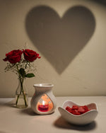 Bulgarian Rose Heart Diffuser Gift Set with red roses and heart-shaped wax melts, creating a romantic ambiance.