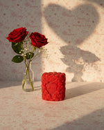 Red Valentine sculpted candle with floral design and 'Love' inscription, perfect for romantic gifting and decor.