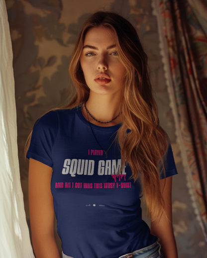 A white female model wearing a navy blue t-shirt with the quote 'I Played Squid Game and All I Got Was This Lousy T-Shirt'