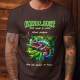 Brown t-shirt featuring a colorful chameleon relaxing on a branch with cannabis leaves, with text about chameleons and fashion.