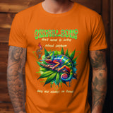 Orange t-shirt with a colorful chameleon relaxing on a branch with cannabis leaves, featuring text about fashion.